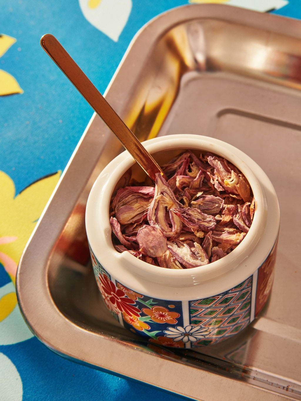 Coastal Purple Shallot by Vân Vân in dish at Abacus Row Handmade Jewelry