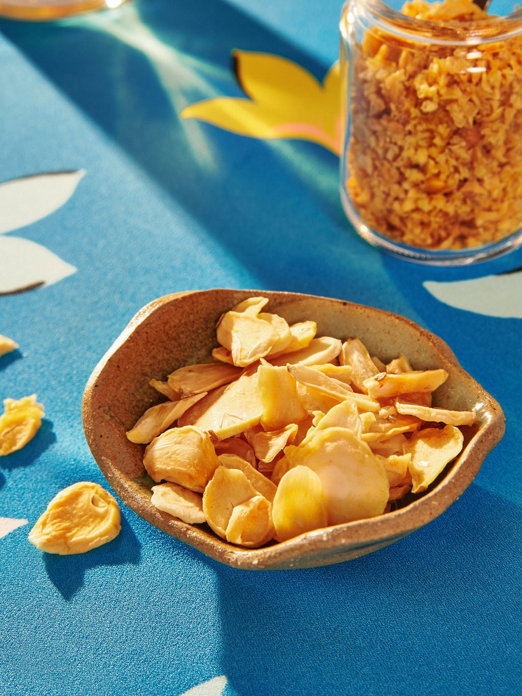 In a bowl Sliced Northern Mountain Garlic by Vân Vân at Abacus Row Jewelry