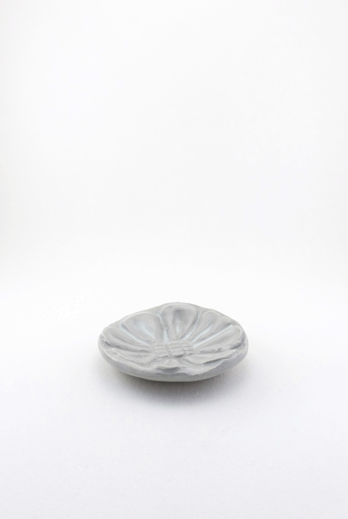 Small Carved Floral Dish by Ariel Clute gif