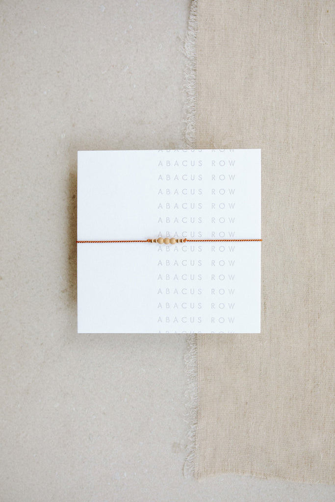 Clay Friendship Bracelet No.1 on card from Abacus Row Handmade Jewelry
