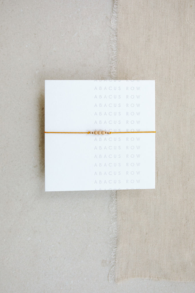 Plantain Friendship Bracelet No.1 on card from Abacus Row Handmade Jewelry