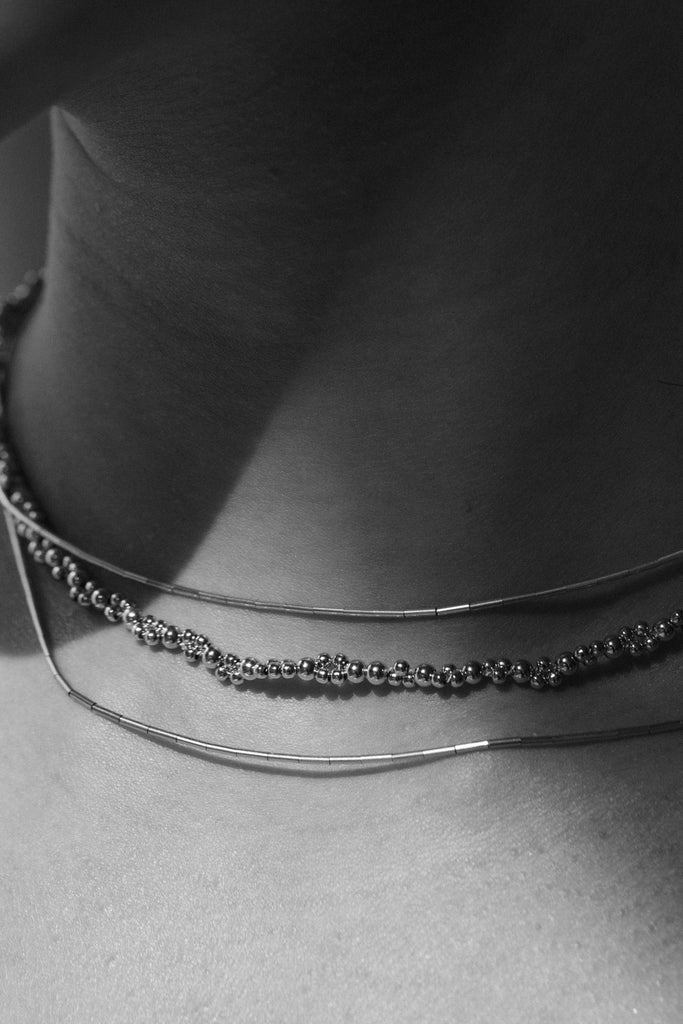 Zeta Necklace detail on model - Abacus Row Handmade Jewelry