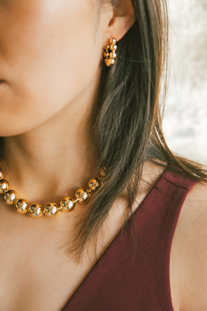 Ba Fa Hoop Earrings and Necklace in ther Yuan Yuan Collection on model  by Abacus Row