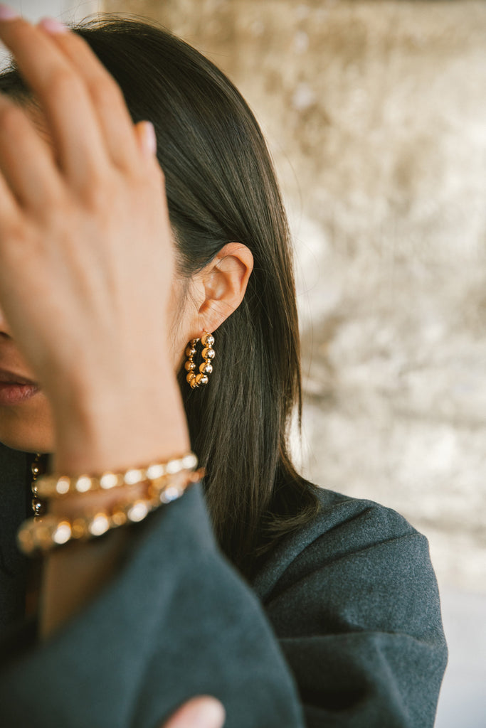 Jiu Jiu Hoop Earrings in the Yuan Yuan Collection Modeled at Abacus Row