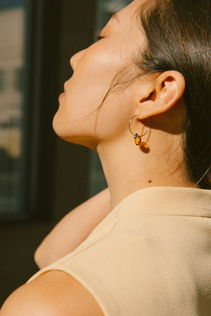 Mandarin Earrings on model at Abacus Row Handmade Jewelry