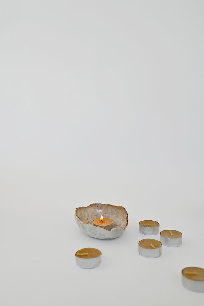 Lit Beeswax Tea Light Candle by Alysia Mazzella and Minh SInger Dish at Abacus Row Jewelry