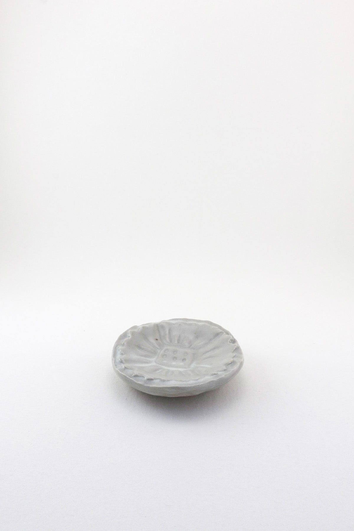 Small Carved Floral Dish by Ariel Clute