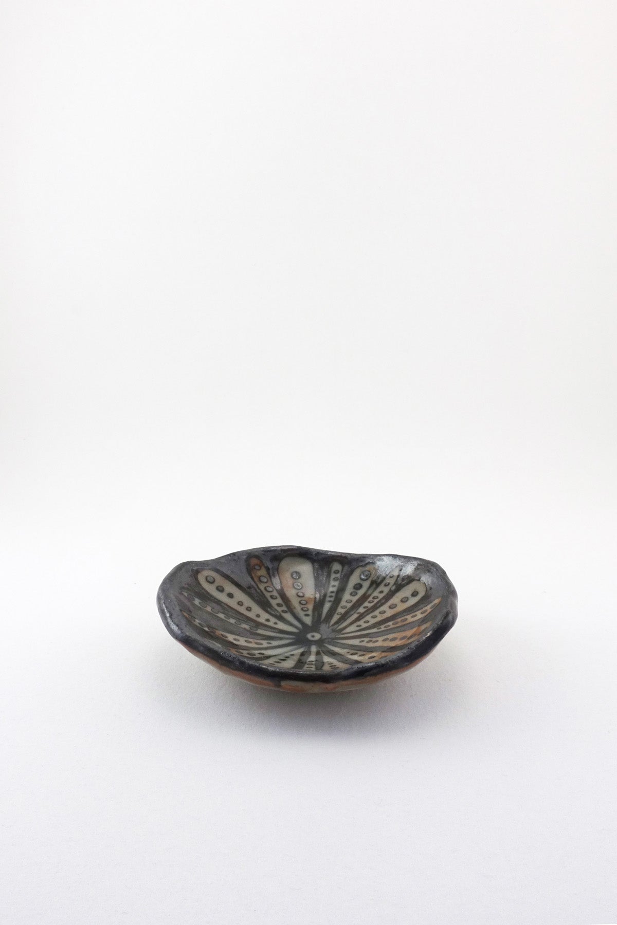 Small Painted Floral Dish in black by Ariel Clute