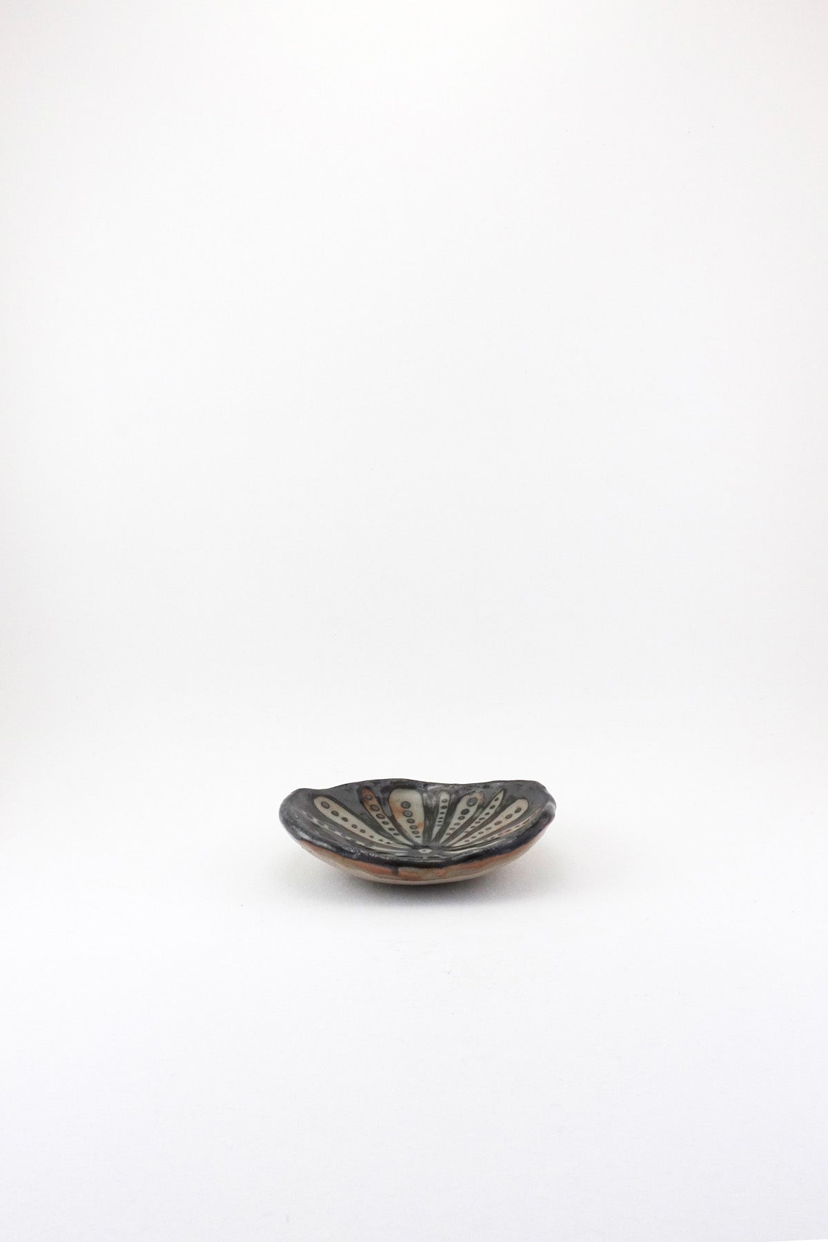 Small Painted Floral Dish in black by Ariel Clute