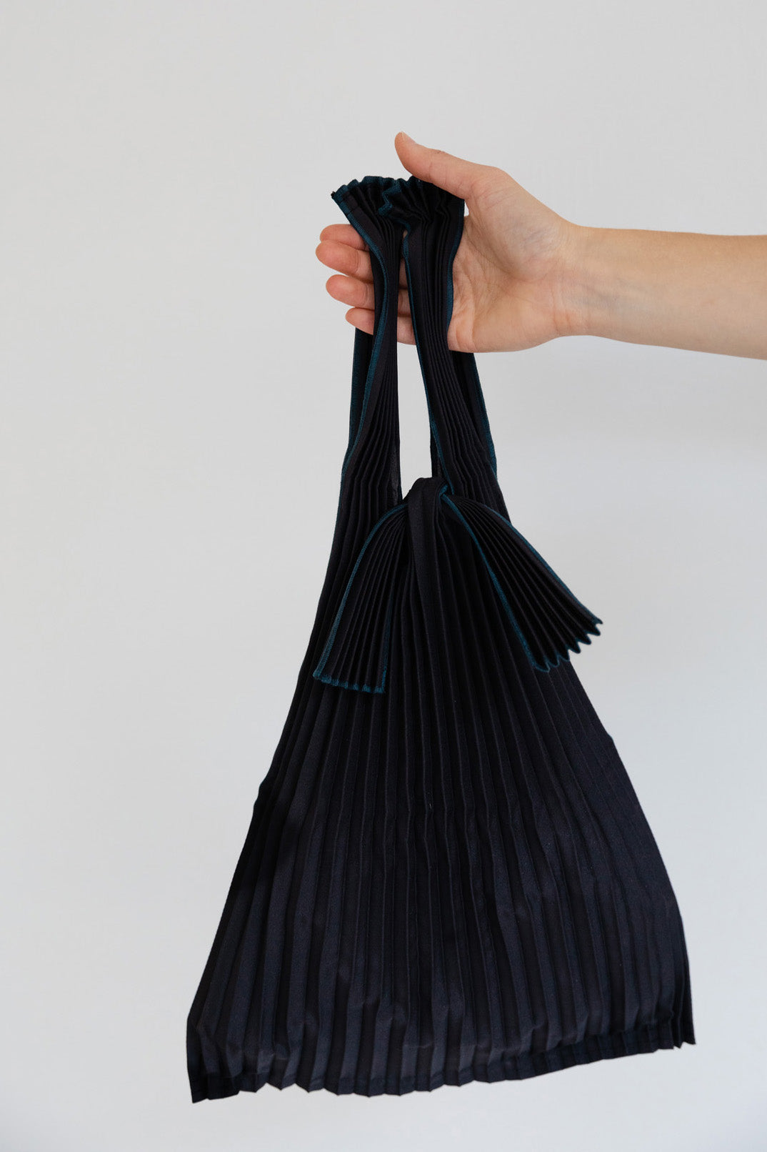 In Hand Small Black Pleated Pleco Tote Bag by KNA Plus at Abacus Row Handmade Jewelry